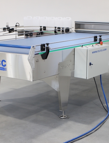 Filling line feed table for canister